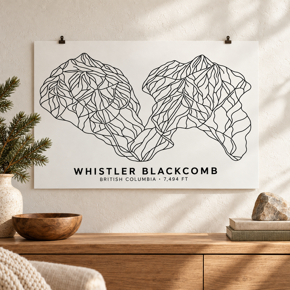 Whistler Blackcomb ski resort poster styled above an oak console